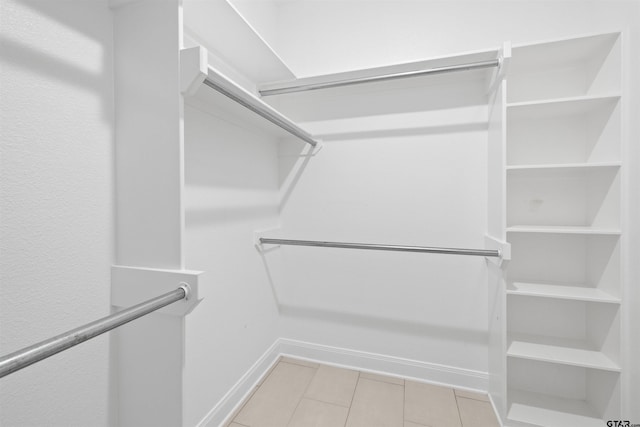 11918 Gillian Ct, Tyler, TX 75703 - walk in closet featuring light tile patterned flooring