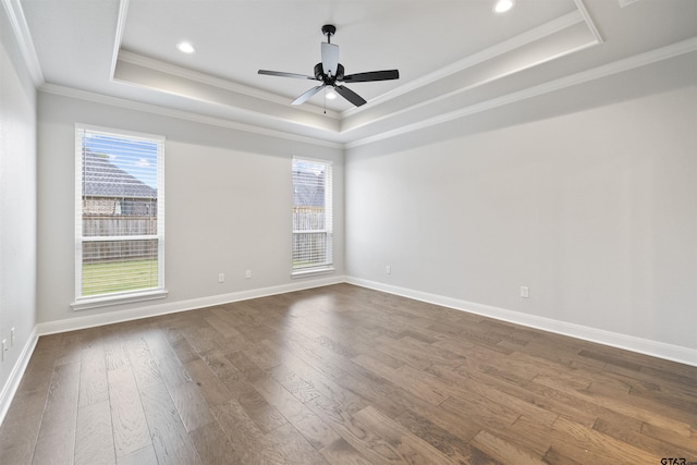 11918 Gillian Ct, Tyler, TX 75703 - unfurnished room featuring a raised ceiling, plenty of natural light, dark wood-style floors, crown molding, and baseboards