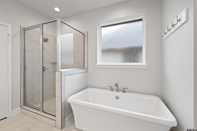 11918 Gillian Ct, Tyler, TX 75703 - full bath featuring a shower stall, a freestanding tub, tile patterned floors, and recessed lighting