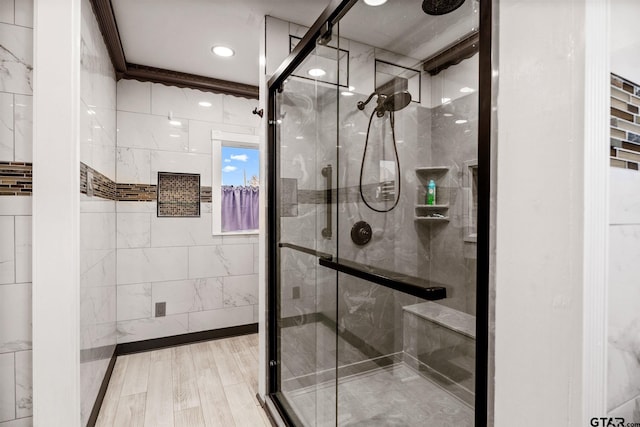 bathroom featuring hardwood / wood-style floors and walk in shower