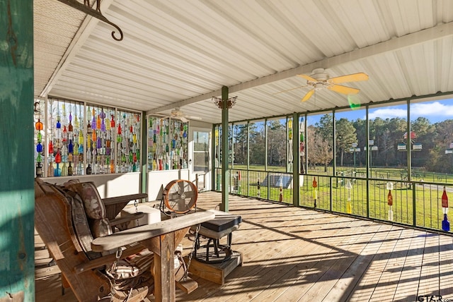 sunroom / solarium featuring ceiling fan