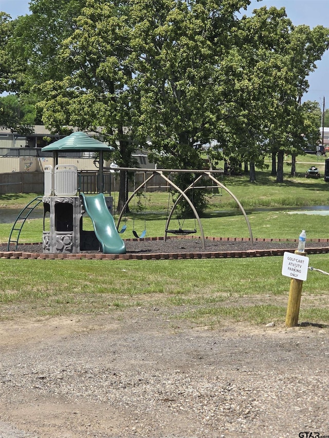111 Little River Bnd, Quitman, TX 75783 - communal playground featuring a lawn and fence