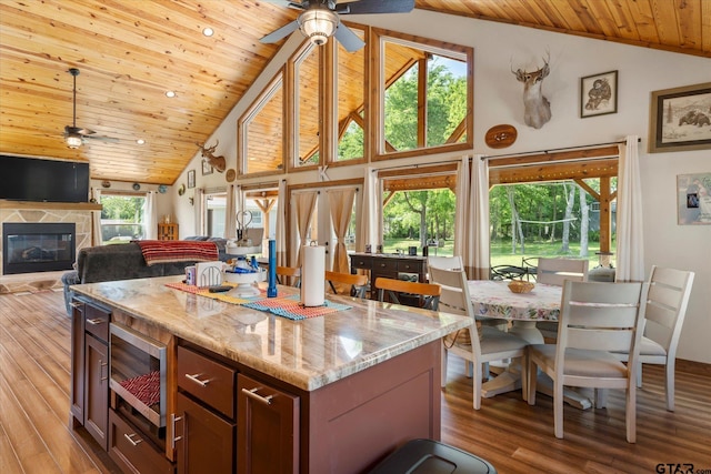 111 Little River Bnd, Quitman, TX 75783 - kitchen featuring stainless steel microwave, a ceiling fan, high vaulted ceiling, and wood ceiling