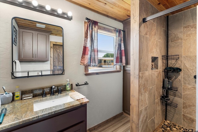 111 Little River Bnd, Quitman, TX 75783 - bathroom featuring wood finished floors, wooden ceiling, tiled shower, and vanity
