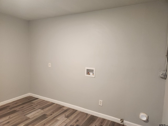 laundry room with hookup for a gas dryer, hookup for a washing machine, and wood-type flooring