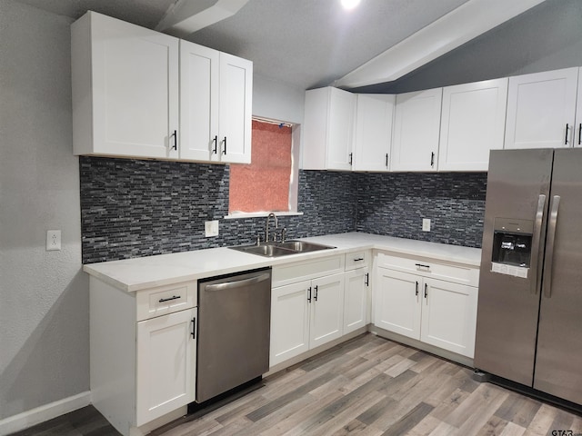 kitchen with white cabinetry, sink, and appliances with stainless steel finishes