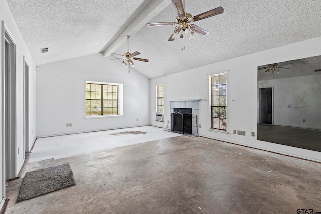 unfurnished living room with a fireplace, a textured ceiling, and vaulted ceiling with beams