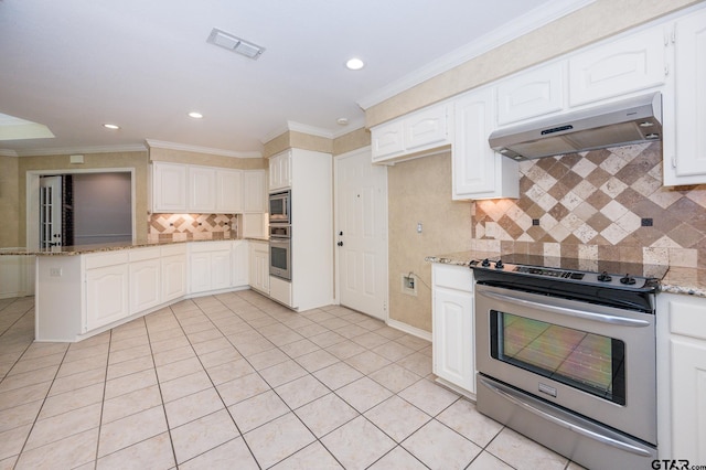 5607 Bostick Dr, Tyler, TX 75707 - kitchen featuring appliances with stainless steel finishes, under cabinet range hood, light stone counters, light tile patterned floors, and backsplash