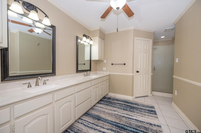 5607 Bostick Dr, Tyler, TX 75707 - bathroom featuring ceiling fan, tile patterned flooring, double vanity, crown molding, and baseboards