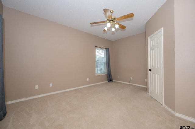 5607 Bostick Dr, Tyler, TX 75707 - spare room with light carpet, baseboards, and ceiling fan