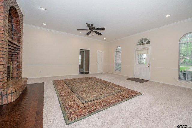 5607 Bostick Dr, Tyler, TX 75707 - foyer with a fireplace, a ceiling fan, carpet, recessed lighting, and baseboards