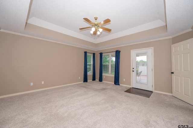 5607 Bostick Dr, Tyler, TX 75707 - unfurnished room with a raised ceiling, carpet floors, ceiling fan, crown molding, and baseboards