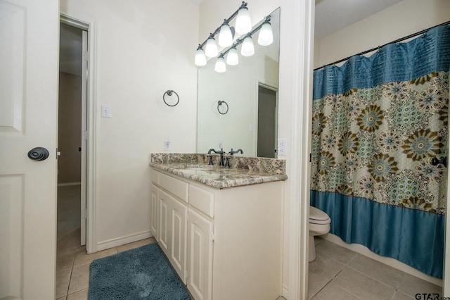 5607 Bostick Dr, Tyler, TX 75707 - bathroom with tile patterned flooring, toilet, and vanity