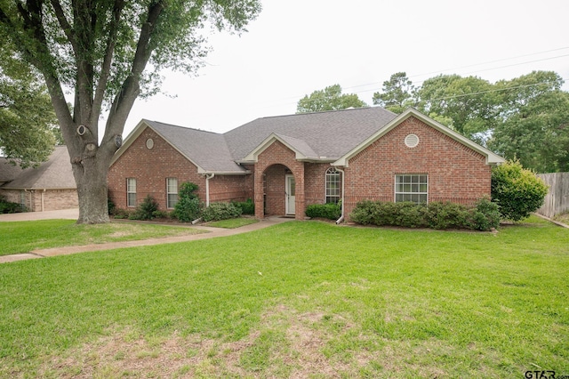 5607 Bostick Dr, Tyler, TX 75707 - view of front of house featuring brick siding and a shingled roof