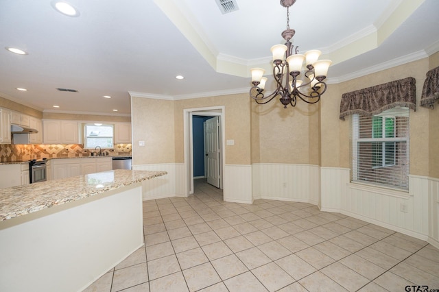 5607 Bostick Dr, Tyler, TX 75707 - unfurnished room with a chandelier, a sink, a wainscoted wall, recessed lighting, and light tile patterned floors