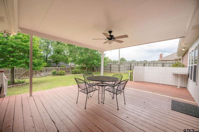 5607 Bostick Dr, Tyler, TX 75707 - wooden deck with outdoor dining area and ceiling fan