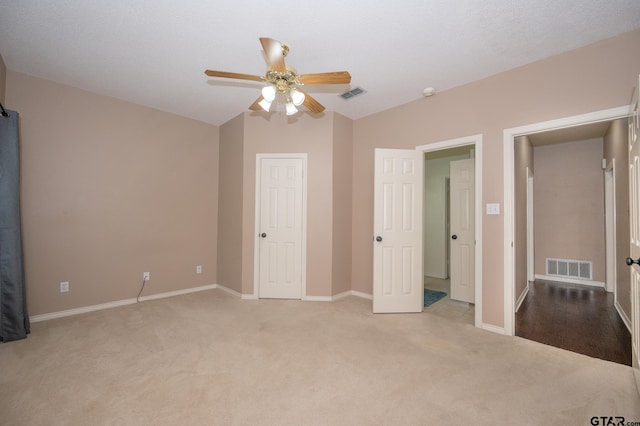 5607 Bostick Dr, Tyler, TX 75707 - unfurnished bedroom featuring carpet floors, baseboards, lofted ceiling, and a ceiling fan