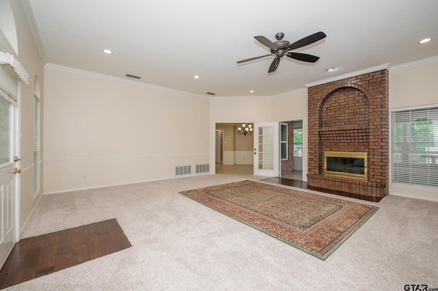 5607 Bostick Dr, Tyler, TX 75707 - unfurnished living room with carpet flooring, ceiling fan, a fireplace, recessed lighting, and crown molding
