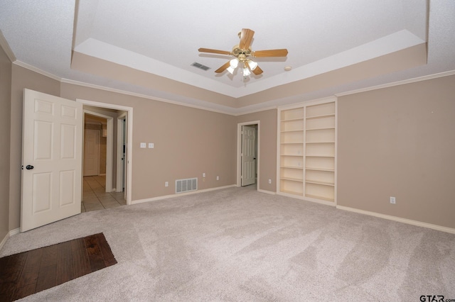 5607 Bostick Dr, Tyler, TX 75707 - unfurnished bedroom featuring a raised ceiling, carpet floors, baseboards, and ornamental molding