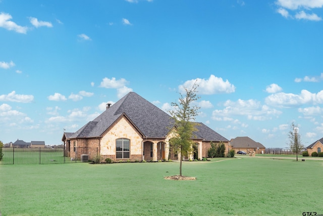 2921 W Alamosa Dr, Terrell, TX 75160 - french country style house with brick siding, a shingled roof, and a chimney