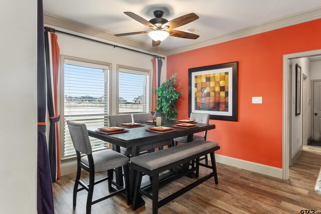 2921 W Alamosa Dr, Terrell, TX 75160 - dining area with ceiling fan, healthy amount of natural light, wood finished floors, baseboards, and crown molding