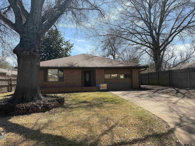 ranch-style house featuring brick siding, a front lawn, fence, a garage, and driveway