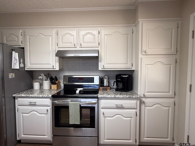 kitchen featuring light stone countertops, under cabinet range hood, appliances with stainless steel finishes, white cabinetry, and backsplash