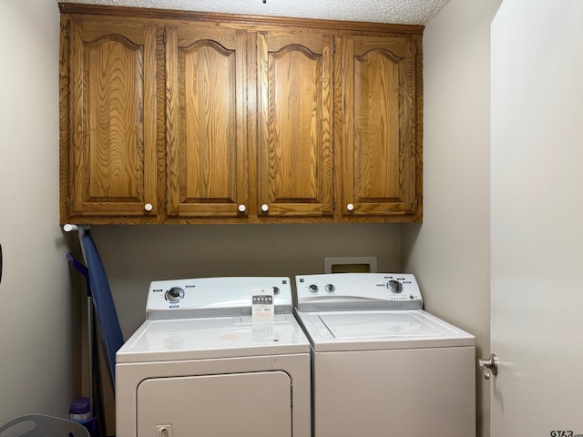 laundry room with washer and dryer and cabinet space