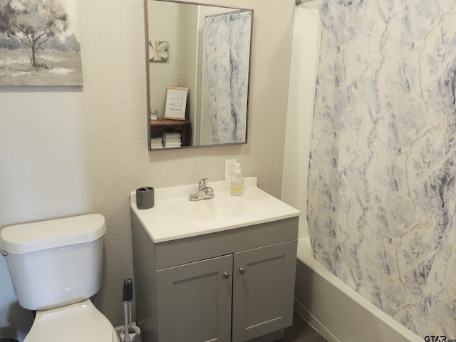 full bathroom with toilet, vanity, and shower / bathtub combination with curtain