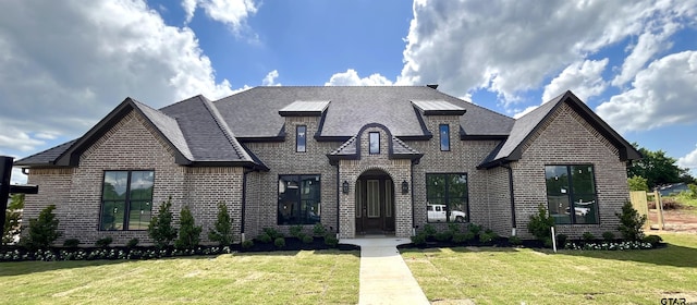 20216 Roebuck Dr, Bullard, TX 75757 - french country home with brick siding, a front yard, and a shingled roof