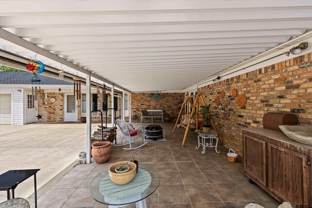 1901 Livingston St, Longview, TX 75601 - view of patio / terrace with a fire pit
