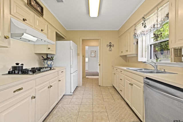 1901 Livingston St, Longview, TX 75601 - kitchen with appliances with stainless steel finishes, a sink, under cabinet range hood, ornamental molding, and light countertops