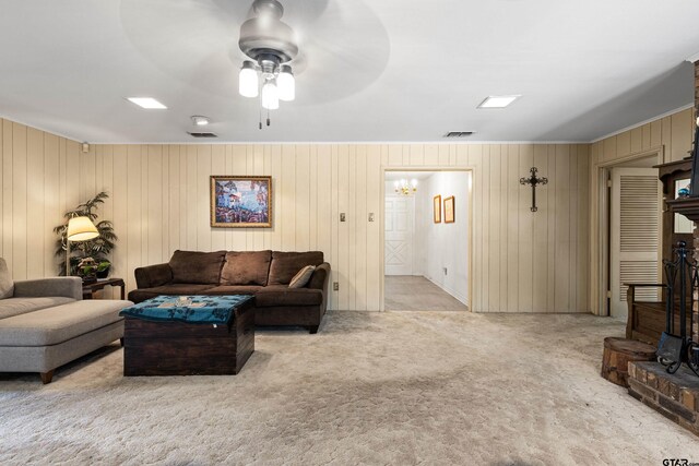 1901 Livingston St, Longview, TX 75601 - living area with carpet flooring, a chandelier, ceiling fan, crown molding, and wood walls