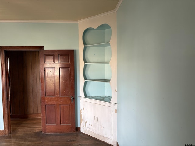 interior space featuring crown molding, built in shelves, and hardwood / wood-style flooring