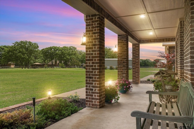 patio terrace at dusk with a lawn