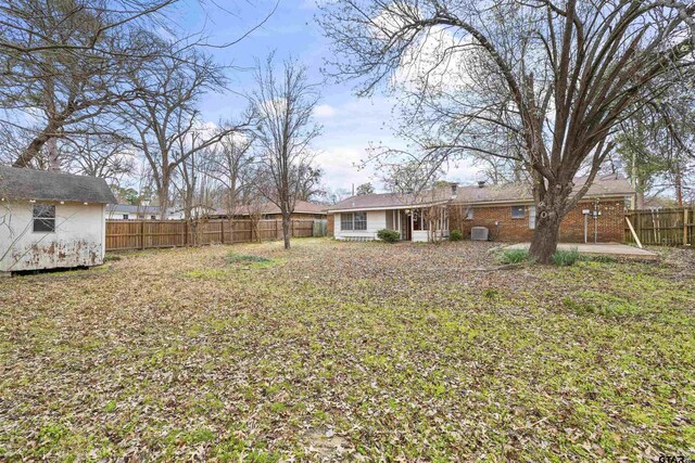 4001 Darrell Ln, Tyler, TX 75701 - fenced backyard with a patio