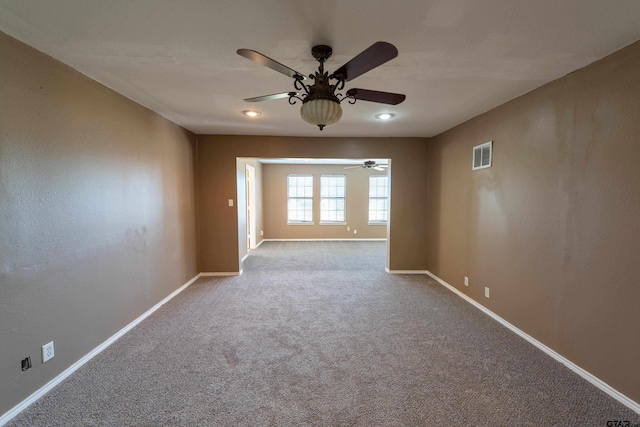 unfurnished room with light carpet and ceiling fan