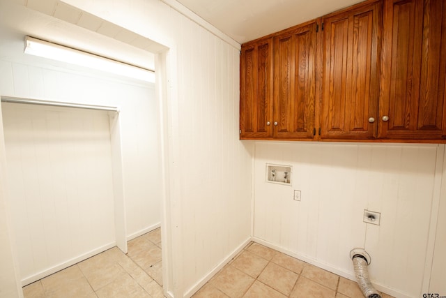 laundry room with cabinets, washer hookup, and electric dryer hookup