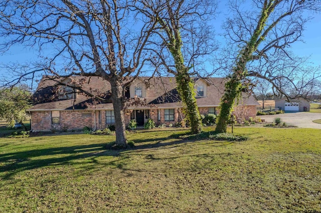 view of front facade with a front yard and a garage