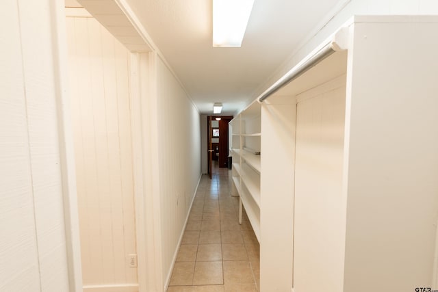 corridor featuring light tile patterned floors