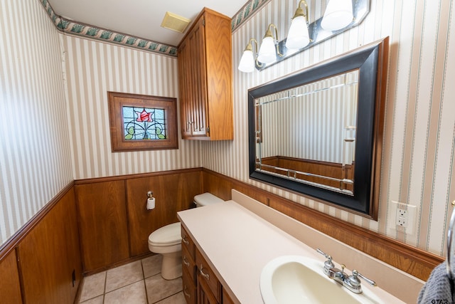 bathroom with tile patterned floors, vanity, and toilet