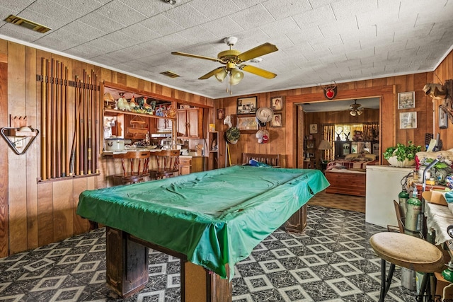 500 W Mclean St, Talco, TX 75487 - game room featuring wooden walls, a ceiling fan, tile patterned floors, and billiards