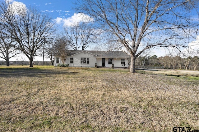 ranch-style house with a front lawn