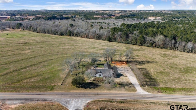 birds eye view of property with a rural view