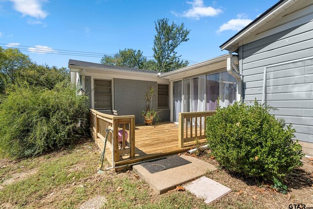 exterior space featuring a wooden deck