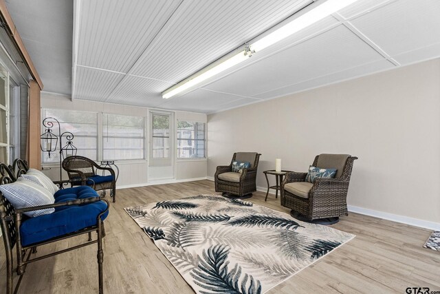 sitting room with light hardwood / wood-style flooring