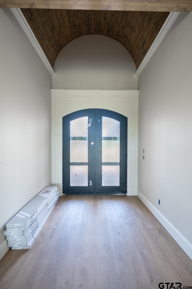 529 Eland Way, Bullard, TX 75757 - entryway with wood finished floors, french doors, lofted ceiling, ornamental molding, and a wall unit AC
