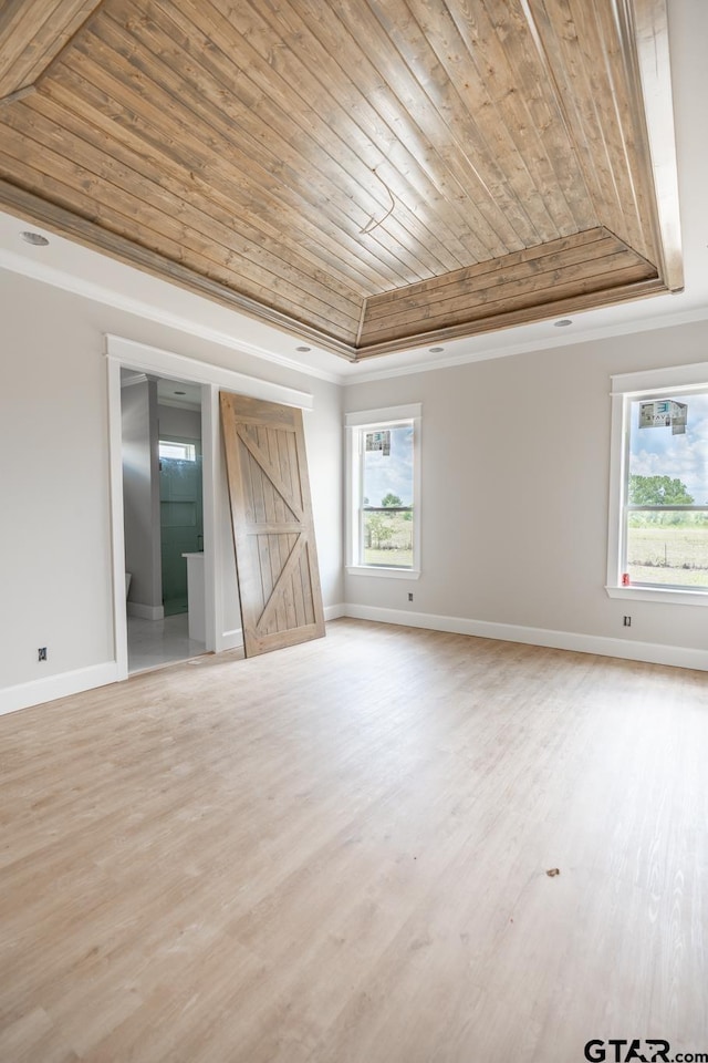 529 Eland Way, Bullard, TX 75757 - empty room featuring wooden ceiling, a tray ceiling, crown molding, and light wood-style flooring