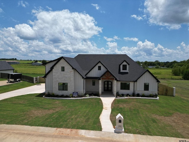 529 Eland Way, Bullard, TX 75757 - modern farmhouse style home with board and batten siding, stone siding, and a front lawn
