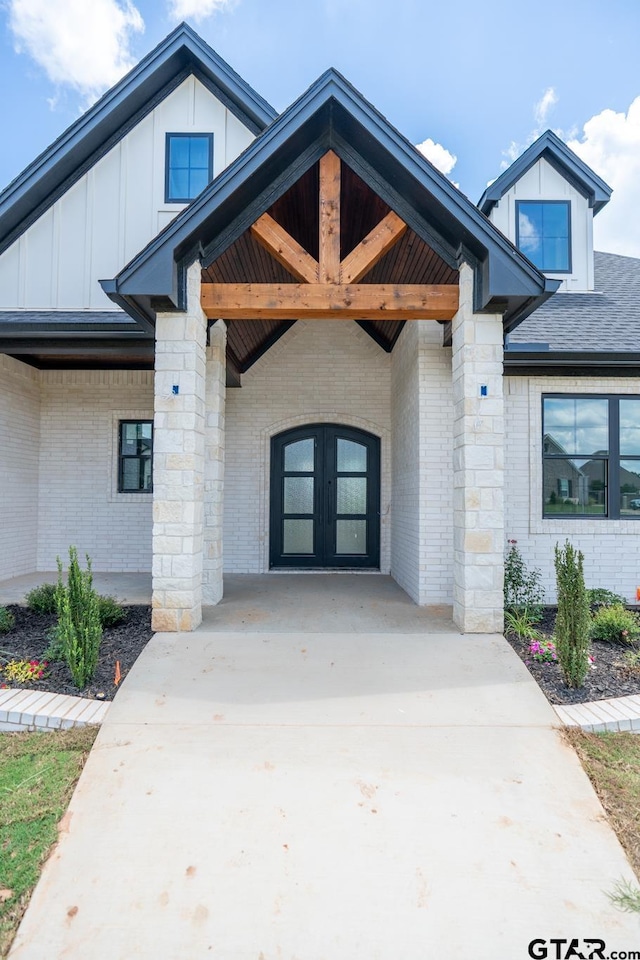 529 Eland Way, Bullard, TX 75757 - entrance to property with board and batten siding, french doors, and brick siding